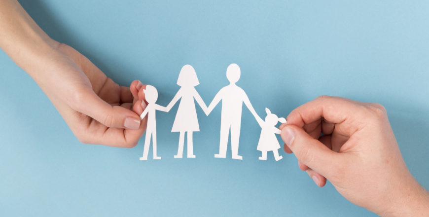 top-view-people-holding-hands-cute-paper-family